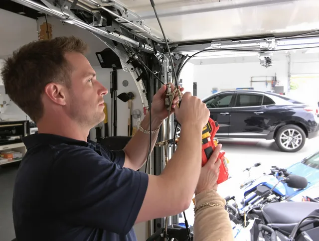 Laguna Hills Garage Door Repair safety certified technician performing cable replacement in Laguna Hills