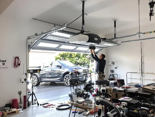 Laguna Hills Garage Door Repair specialist installing smart garage door opener system in Laguna Hills home